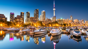 cn tower at night from lake ontario