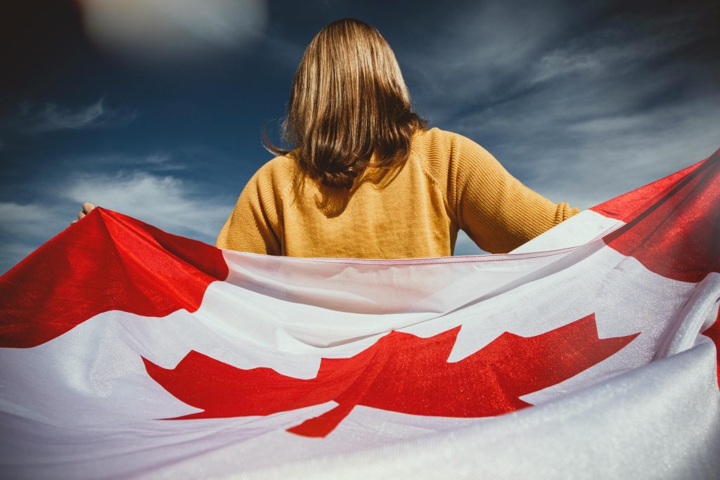 Woman holding canada flag